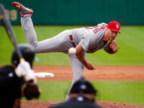 St. Louis Cardinals pitcher Adam Wainwright delivers to Pittsburgh Pirates’ Josh Harrison in Pittsburgh, Wednesday, Sept. 30,  2015. (AP Photo/Gene J. Puskar)