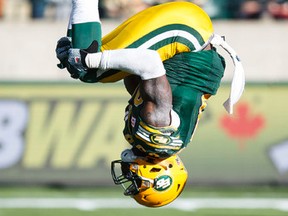 Willie Jefferson performs a backflip after his strip tackle of Lions quarterback Jonathon Jennings on Saturday. (Ian Kucerak, Edmonton Sun)