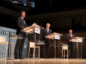 Liberal leader Justin Trudeau (L), Conservative leader and Prime Minister Stephen Harper, and New Democratic Party (NDP) leader Thomas Mulcair (R) take part in the Munk leaders' debate on Canada's foreign policy in Toronto, Canada September 28, 2015. Canadians go to the polls in a federal election on October 19, 2015.  REUTERS/Fred Thornhill