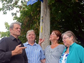 A group of residents stand on the corner of the formerly named Feriand St. They're upset that the city is changing the name of their street, correcting, in the process what it says is a 68-year-old spelling mistake.