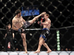 Russia's Ruslan Magomedov (left) and Czech Republic's Viktor Pesta fight in the ring during the UFC Fight Night at the O2 World in Berlin on May 31, 2014. (AFP PHOTO/DAVID GANNON)