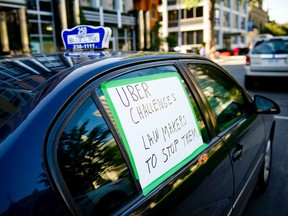 Cab drivers came to City Hall Wednesday August 16, 2015 to protest Uber and the impact it's having on the taxi industry. (Ashley Fraser/Ottawa Sun)