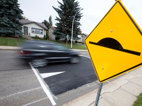 Traffic makes its way over new traffic calming speed bumps (speed tables) near 64 Street and 94 B Avenue, in Edmonton Alta. on Tuesday Sept. 29, 2015. The City is introducing new traffic calming measure in four Edmonton neighbourhoods. David Bloom/Edmonton Sun