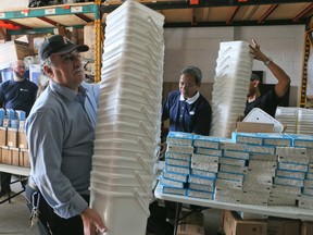 GlobalMedic volunteers pack over one thousand family emergency kits to be sent to Iraq to help refugees fleeing Syria on Sept. 30, 2015 in Toronto. (Veronica Henri/Toronto Sun)