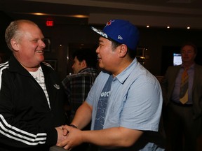 Councillor Rob Ford, with co-star Johnny Kim, at the advanced screening "Toronah" on Wednesday Sept. 30, 2015. (STAN BEHAL/Toronto Sun)
