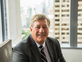 Former Ontario premier Mike Harris poses for a photo in downtown Toronto, Ont., in this June 25, 2015 file photo. (Ernest Doroszuk/Toronto Sun/Postmedia Network)