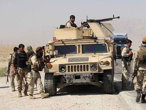 Afghan security forces prepare to check on reports of a possible ambush by the Taliban on the Baghlan-Kunduz highway, Afghanistan Oct. 1, 2015.  REUTERS/Stringer