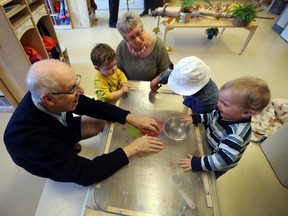 John and Betty Boutillier play with Primrose Day Care children at Ottewell Terrace in Edmonton on Wednesday. The seniors residence is an inter-generational housing project. (Perry Mah/Edmonton Sun)