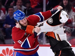 Brandon Prust of the Montreal Canadiens and Clayton Stoner of the Anaheim Ducks fight at the Bell Centre in Montreal on Dec. 18, 2014. (Richard Wolowicz/Getty Images/AFP)
