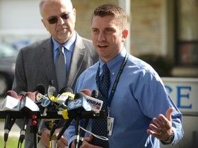 Lake County Major Crimes Task Force Cmdr. George Filenko, left, and Lake County Sheriff's Det. Christopher Covelli speak during a news conference giving an update on the investigation into the death of Fox Lake Police Lt. Joe Gliniewicz Thursday, Oct. 1, 2015 in Fox Lake, Ill. Filenko said that Gliniewicz was shot with his own weapon.  (Paul Valade/Daily Herald via AP)