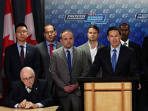 The Honourable Pierre Poilievre (at podium), along with National Capital Region Conservative Party Candidates, release an Open Letter to the Public Service outlining the Prime Minister's commitment to working in partnership with the Public Service during a press conference at the National Press Theatre in Ottawa, Ont. on Thursday October 1, 2015. Errol McGihon/Ottawa Sun/Postmedia Network