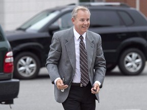 Dennis Oland arrives at the Law Courts in Saint John, N.B. on Wednesday, Sept. 9, 2015 as jury selection continues for his trial. The lead investigator in Richard Oland's murder has testified that a rear exit from the businessman's office building was locked from the inside the morning Oland was found dead in his New Brunswick office. THE CANADIAN PRESS/Andrew Vaughan