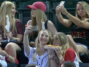 A group of selfie-taking women attend the Arizona Diamondbacks-Colorado Rockies game at Chase Field in Phoenix on Sept. 30, 2015.