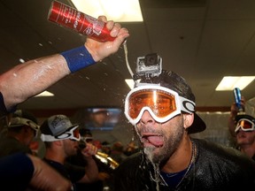 David Price and the Toronto Blue Jays celebrate in the clubhouse after clinching the AL East at Oriole Park at Camden Yards in Baltimore on Sept. 30, 2015. (Patrick Smith/Getty Images/AFP)