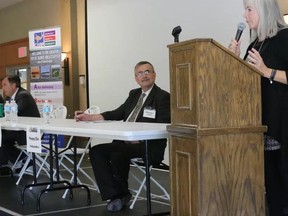 BRUCE BELL/THE INTELLIGENCER
CARP Greater Bay of Quinte Chapter 39 chairperson Mary Robertson introduces federal candidates (from left) Liberal Neil Ellis, NDP Terry Cassidy and Independent Trueman Tuck at an all candidates meeting in Wellington Thursday afternoon.