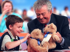 Grant Smith spends some time with Max Keeping at the CHEO telethon in 1999.
