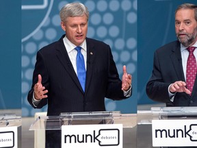 In this composite image, Liberal Leader Justin Trudeau, left to right, Conservative Leader Stephen Harper and NDP Leader Thomas Mulcair take part in the Munk Debate on foreign affairs, in Toronto, on Monday, Sept. 28, 2015. THE CANADIAN PRESS