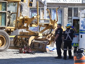 A 58-year-old woman was killed after she was struck by a grader at the corner of Beech and Elgin street in Sudbury, Ont. on Wednesday September 30, 2015. Gino Donato/Sudbury Star/Postmedia Network