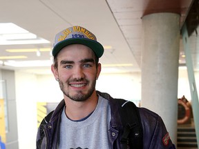 Luke McAllister,a second-year Queen's University engineering student, on campus on Thursday. He's running for the Libertarian party for Kingston and the Islands in the federal election. (Ian MacAlpine /The Whig-Standard)