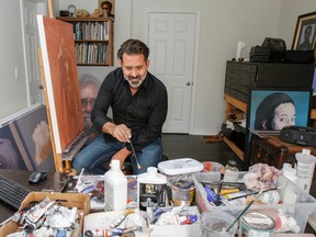 Dan Hughes, a portrait artist, works on his most recent piece in his home studio in Kingston. (Julia McKay/The Whig-Standard)