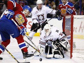 Edmonton's Brayden Brown (left) is stopped by Red Deer's goaltender Rylan Toth (right) during the second period of a WHL hockey game between the Edmonton Oil Kings and the Red Deer Rebels in Edmonton, Alta. on Sunday September 27, 2015. Ian Kucerak/Edmonton Sun/Postmedia Network