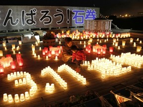 Candles placed to form the date of the March 11, 2011, earthquake and tsunami disaster is displayed during a memorial event to mourn the victims of the disaster in Ishinomaki, Miyagi prefecture, in this photo taken by Kyodo March 11, 2015. (Reuters)