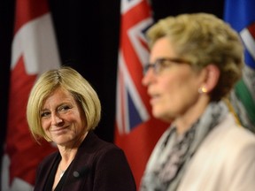 Alberta Premier Rachel Notley (left) and Ontario Premier Kathleen Wynne during a media availability at Queen's Park in Toronto, Thursday, Oct, 1, 2015. THE CANADIAN PRESS/Marta Iwanek