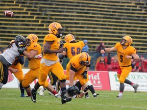 Queen's quarterback Nate Hobbs throws a pass during a 47-24 win over the Waterloo Warriors in Ontario University Athletics football action at Richardson Stadium on Sept. 12. (Steph Crosier/The Whig-Standard)