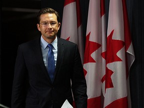 The Honourable Pierre Poilievre walks into the National Press Theatre to release an Open Letter to the Public Service outlining the Prime Minister's commitment to working in partnership with the Public Service during a press conference in Ottawa, Ont. on Thursday October 1, 2015. Errol McGihon/Ottawa Sun/Postmedia Network