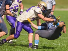 Central?s Chase Brock flips Lucas?s Ian Guenther Green onto his back during their TVRA Central Conference senior football game at Lucas on Thursday. The host Vikings won 28-22. (MIKE HENSEN, The London Free Press)