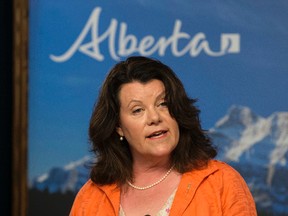 Jobs, Skills, Training and Labour Minister Lori Sigurdson announces that Alberta's minimum wage will increase from $10.20 to $11.20 as of Oct. 1., during a press conference at the Alberta Legislature in Edmonton Alta. on Monday June 29, 2015. David Bloom/Edmonton Sun/Postmedia Network