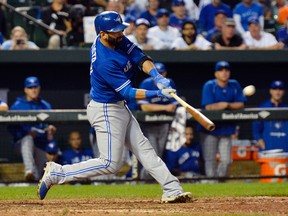 Jose Bautista of the Toronto Blue Jays hits a solo home run in the ninth inning against the Baltimore Orioles at Oriole Park at Camden Yards on Sept. 30, 2015. (TOMMY GILLIGAN/USA TODAY Sports)