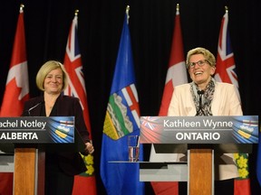 Alberta Premier Rachel Notley (left) and Ontario Premier Kathleen Wynne during a media availability at Queen's Park in Toronto, Thursday, Oct, 1, 2015. THE CANADIAN PRESS/Marta Iwanek