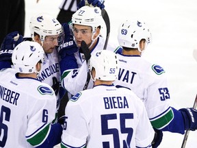 Sven Baertschi, No. 47, celebrates a goal with his teammates during Thursday's game at Rexall place. (The Canadian Press)