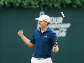 Jordan Spieth of the United States celebrates on the 18th green after his four-stroke victory at the TOUR Championship By Coca-Cola on his way to also securing the FedExCup at East Lake Golf Club on September 27, 2015 in Atlanta, Georgia. (Scott Halleran/AFP)