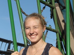 Teresa Thomas stops for a picture before entering a combine on a grain farm just north of Vermilion. Thomas, a Grade 10 student, is from Vienna, Austria and is staying in Vermilion throughout the duration of the school year as part of Rotary International's Youth Exchange program.