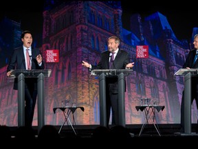 Liberal leader Justin Trudeau, left, NDP leader Tom Mulcair and Conservative leader Stephen Harper, right, take part in the Globe and Mail  leaders' debate Thursday, September 17, 2015  in Calgary.THE CANADIAN PRESS/Jonathan Hayward