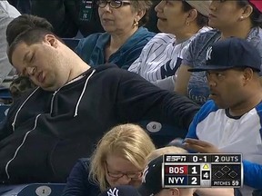 Andrew Rector, seen here in a video still, attended a Yankees game in April 2014 and was filmed while he slept in the stands. (MLB.com)