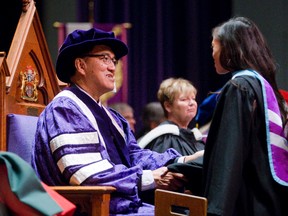 Western University president Amit Chakma congratulates a graduate from the faculty of education during their graduation ceremony at Alumni Hall in June. (London Free Press file photo)
