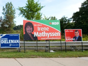 Election signs promoting federal candidates in the London-Fanshawe riding line a sidewalk along Commissioners Road in London. Craig Glover/The London Free Press/Postmedia Network