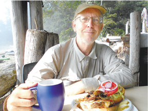 Best burger ever. Free Press reporter John Miner, who hiked the West Coast Trail in August with his wife, Laurel, and son Matt, indulges one of Chez Monique?s burgers. The verdict ? best he ever had. (Laurel Miner/Special to The London Free Press)