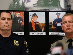 The photos of three of the victims of the mass shooting at Umpqua Community College are displayed at a news conference, Friday, Oct. 2, 2015, in Roseburg, Ore.  In the photos, from left, are Quinn Cooper, 18, Lucas Eibel, 18,  center, and Jason Johnson, 33. They were among those killed when Chris Harper-Mercer, walked into a class at the community college, Thursday, and opened fire. At left is Portland Police Sgt. Peter Simpson and right is Douglas County Sheriff John Hanlin. (AP Photo/Rich Pedroncelli