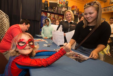 Mable "Spider-Mable" Tooke, (6) signs original Spider-Mable illustrations (created by James Clement) at Happy Harbour Comics, 10729 - 104 Ave., in Edmonton Alta. on Friday Oct. 2, 2015. Organizers hoped to raise $5,000 for the Leukemia and Lymphoma Society of Canada. David Bloom/Edmonton Sun/Postmedia Network