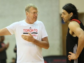 Former NBA champion Jack Sikma chats with Luis Scola at camp in Burnaby, B.C., yesterday. Sikma arrived yesterday to work with Jonas Valanciunas. (KIm Stallknecht/Postmedia Network)
