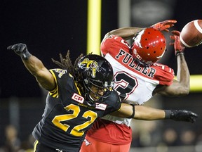 Hamilton Tiger-Cats defender Courtney Stephen breaks up a pass intended for Calgary Stampeders receiver Jeff Fuller (3) during their game in Hamilton October 2, 2015. (REUTERS/Mark Blinch)