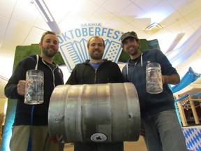 Ready to hoist a stein, and a keg, at the Sarnia Oktoberfest are, from left, Chris Lewis, Nathan Colquhoun and Aaron Robb from Storyboard Cultural Community Endeavours, on Friday October 2, 2015 at the Bayside Centre in Sarnia, Ont. The event opened Friday evening, and continues Saturday, 3 p.m. to 12:30 a.m. Sunday, with music, beer, food and games. Admission is $10. Paul Morden/Sarnia Observer/Postmedia Network