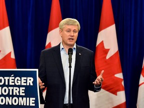 Conservative leader Stephen Harper speaks to the media during a campaign stop Montreal Que., on Saturday, October 3, 2015. (THE CANADIAN PRESS/Nathan Denette)