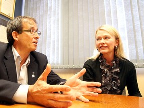 Candice Bergen, minister of State for Social Development, and the Conservative candidate for Lisgar-Portage, looks on as Sudbury Conservative candidate Fred Slade talks with the media in Sudbury, Ont. on Friday October 2, 2015. Gino Donato/Sudbury Star/Postmedia Network