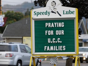 A sign in remembrance for those killed in a fatal shooting at Umpqua Community College, is displayed at a local business, Saturday, Oct. 3, 2015, in Roseburg, Ore.  Armed with multiple guns, Chris Harper Mercer, 26, walked in a classroom at the community college, Thursday, and opened fire, killing several and wounding several others. (AP Photo/Rich Pedroncelli)
