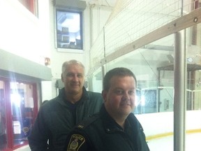 Hockey Winnipeg executive director Monte Miller (left) and Const. Brad Sparrow at the launch of the second year of the CHECK-ing In program at the Jonathan Toews Multiplex at Saturday, Oct. 3, 2015. (Glen Dawkins/Winnipeg Sun/Postmedia Network)